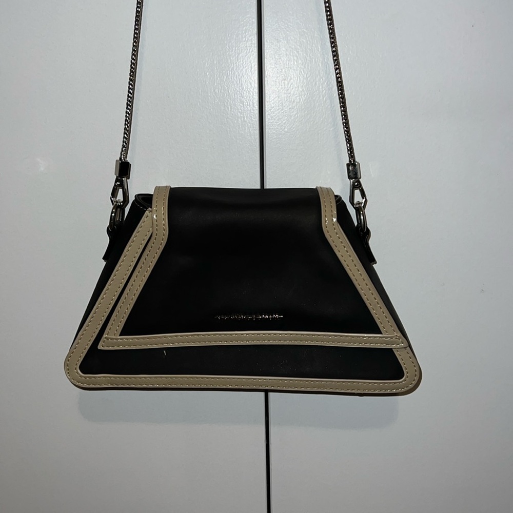 Black leather bag with silver chain and tan lining